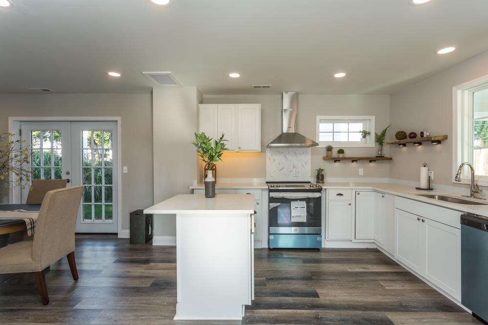 402 5th Street Shenandoah, VA 22849 - Photo 6 of 52 a kitchen with granite countertop white cabinets and white appliances