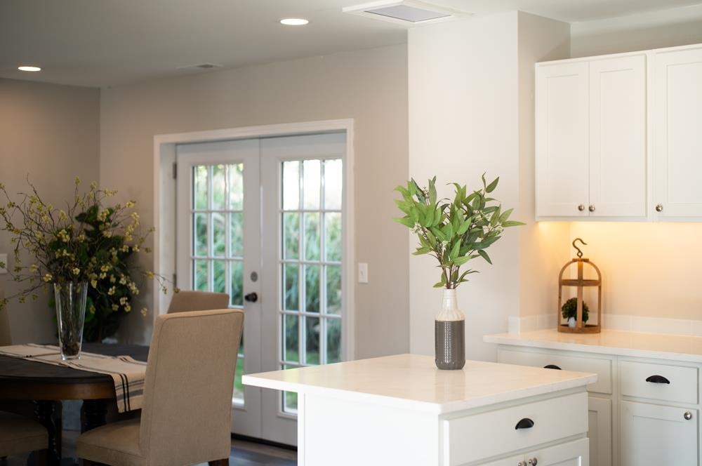 402 5th Street Shenandoah, VA 22849 - Photo 9 of 52 a kitchen with a large window a sink and white cabinets