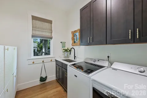 a bathroom with a granite countertop toilet sink and mirror