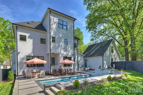 a view of a house with a yard and plants