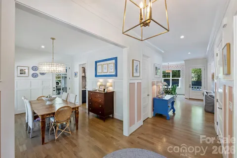 a view of a livingroom with furniture window and wooden floor