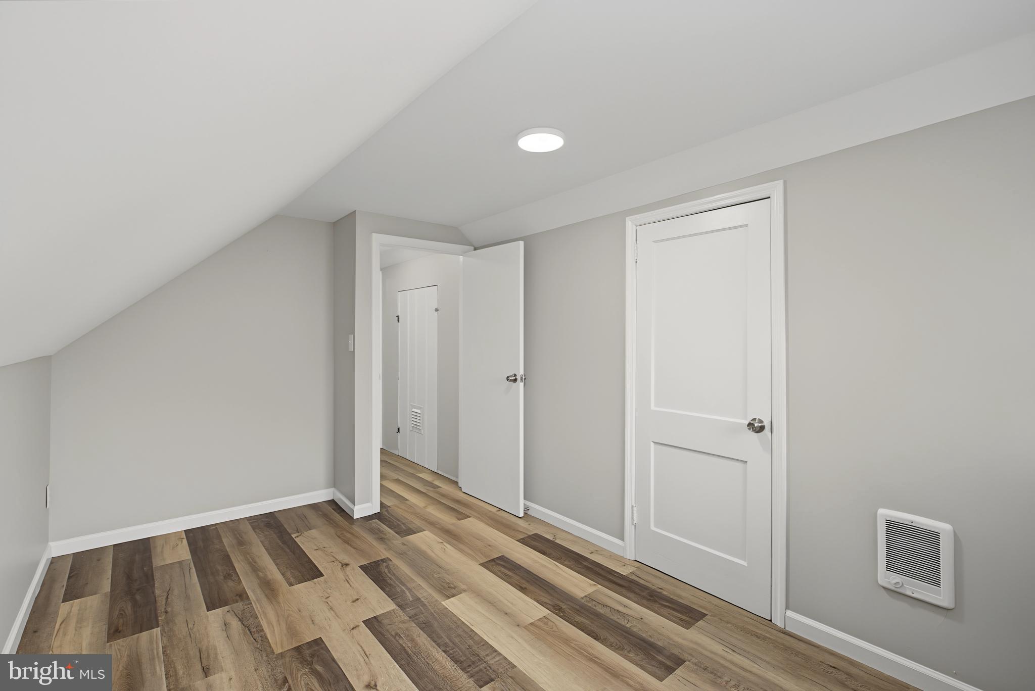 113 Rutledge Avenue Ewing, NJ 08618 - Photo 24 of 27 a view of a room with wooden floor and bathroom
