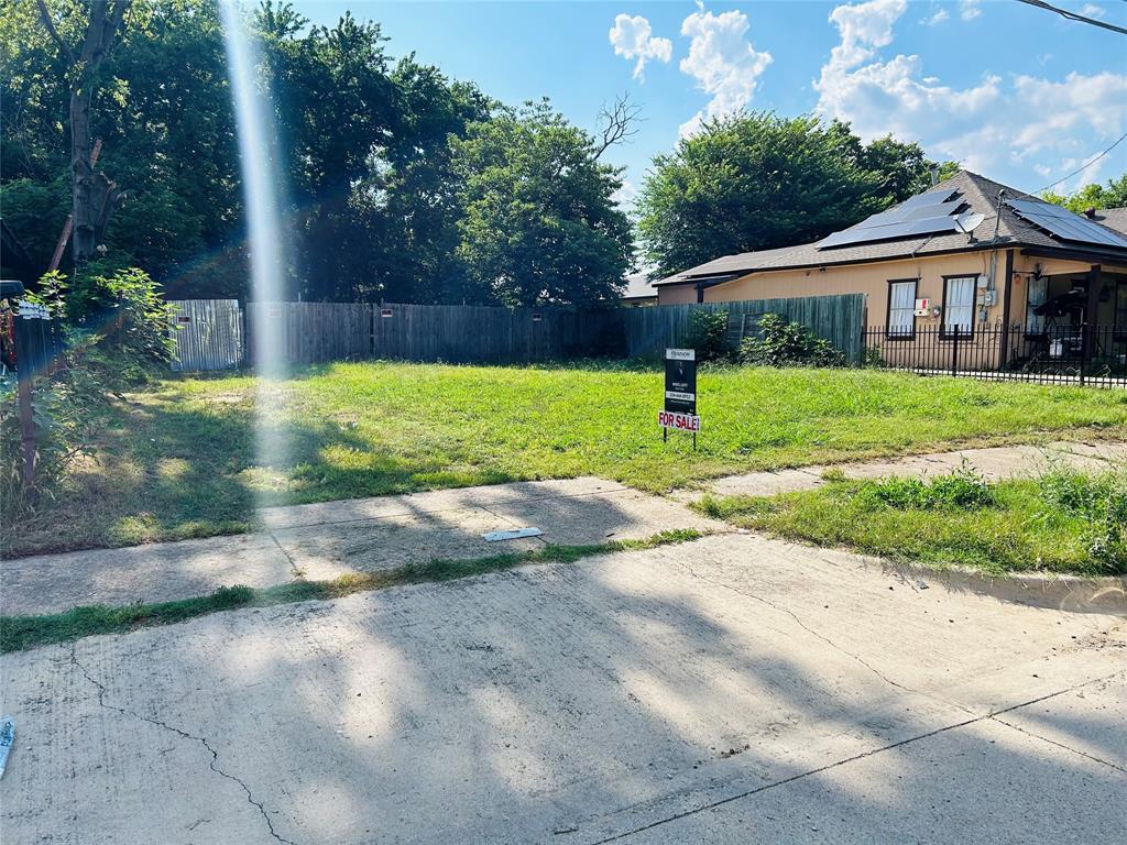 a view of a house with a yard and a garden