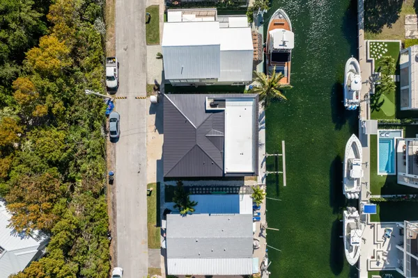 an aerial view of houses with outdoor space