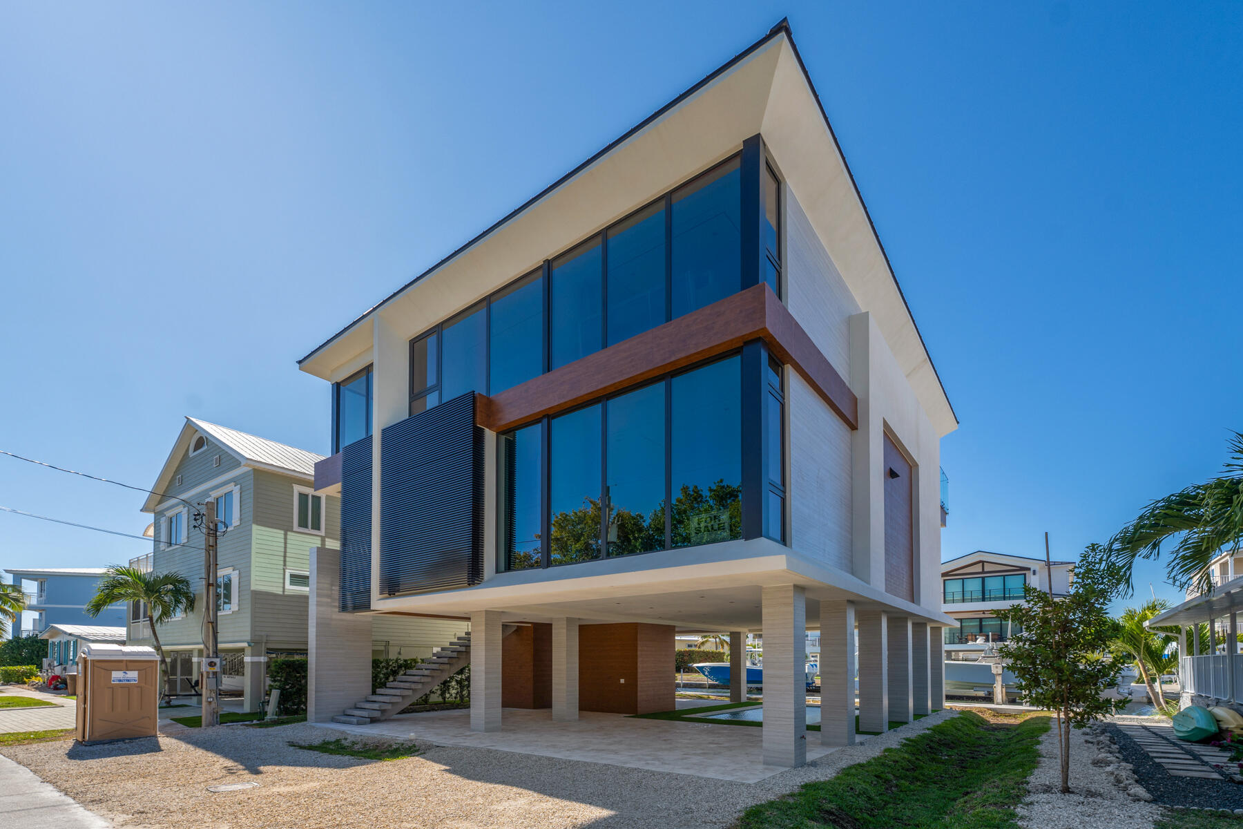 108 Coral Way Key Largo, FL 33037 - Photo 2 of 23 a view of house with outdoor space and parking