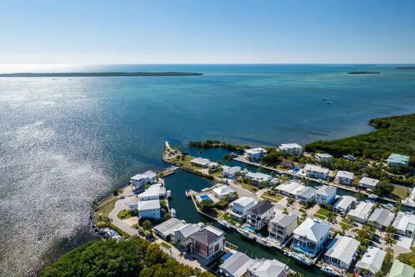 an aerial view of a city with ocean view