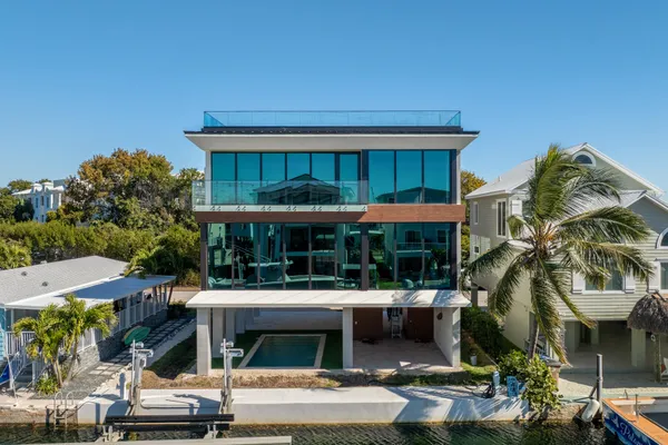 a front view of a building with parking