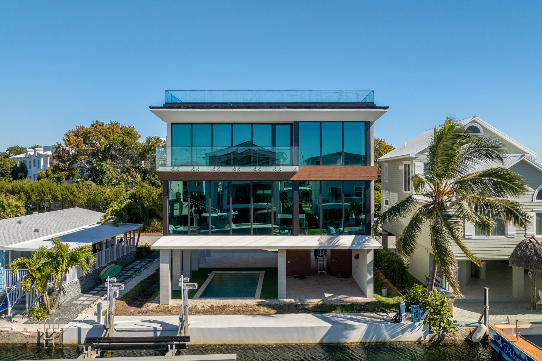 108 Coral Way Key Largo, FL 33037 - Photo 3 of 23 a front view of a building with parking
