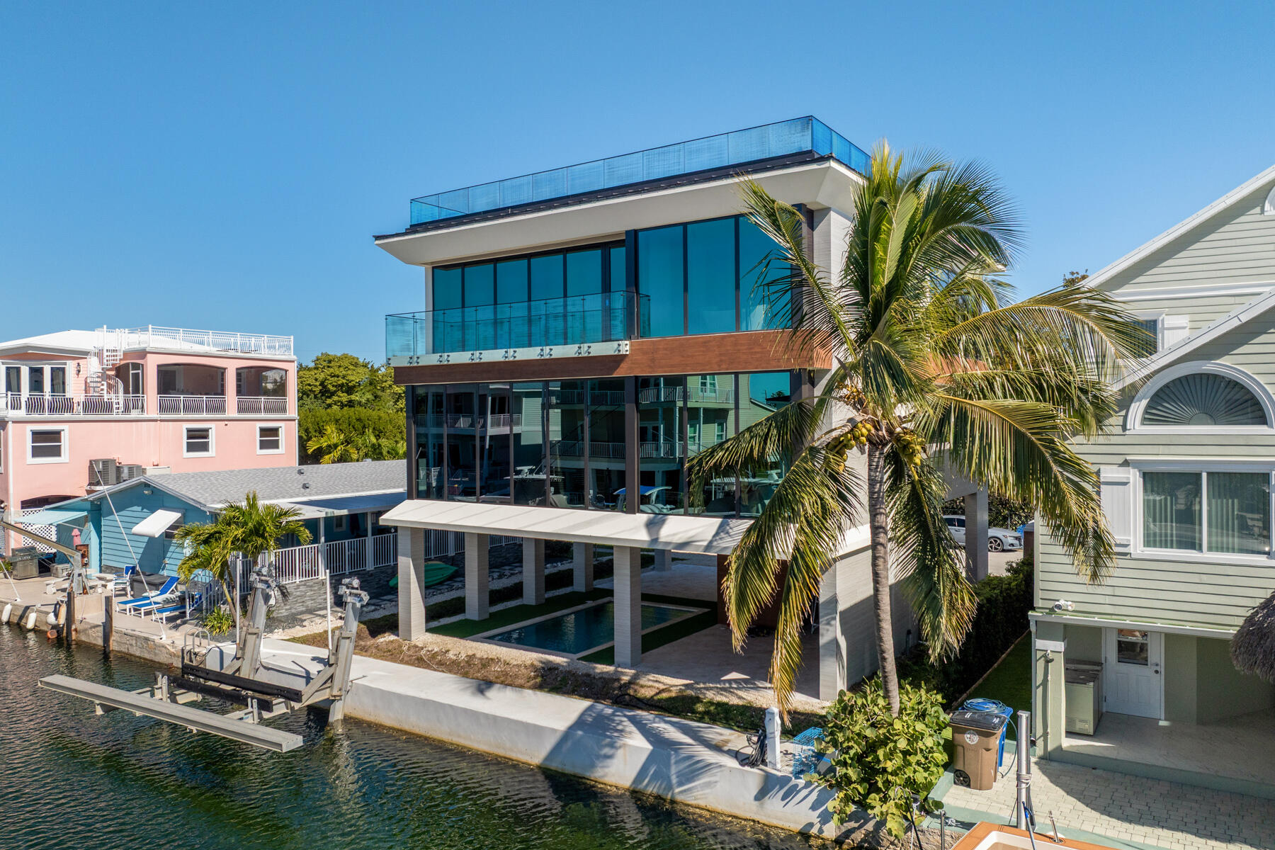 108 Coral Way Key Largo, FL 33037 - Photo 5 of 23 a front view of a house with garden