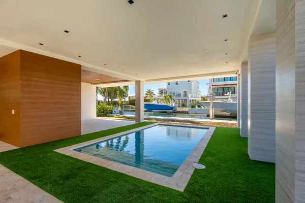 a view of a backyard with a small pool