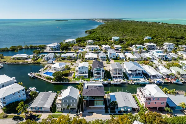 an aerial view of residential houses with outdoor space