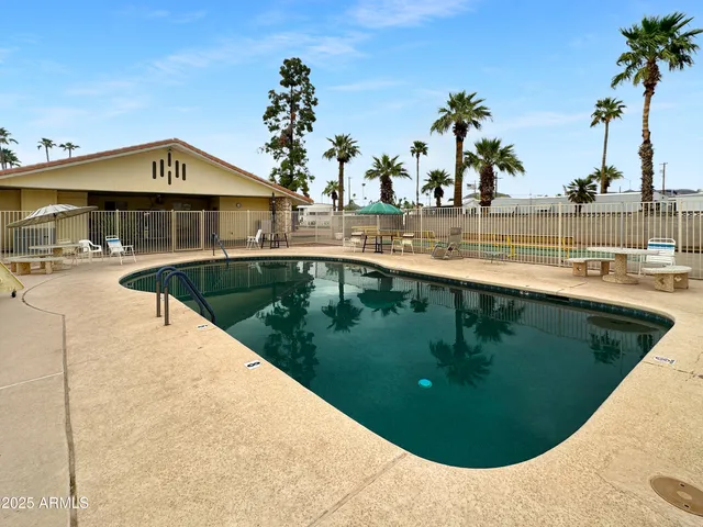 a view of a car park in front of house