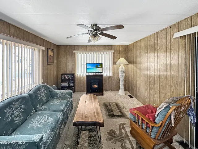 a living room with furniture a couch and a chandelier