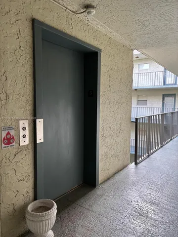 a kitchen with a sink and a stove top oven