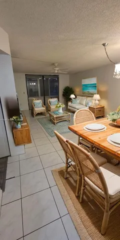 a view of a kitchen with sink and cabinets