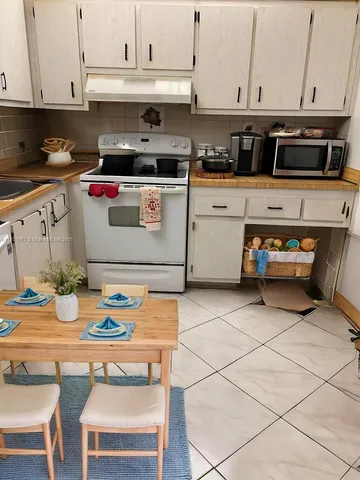 a bedroom with bed and a book shelf