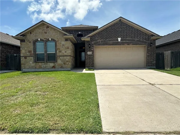 a front view of a house with yard