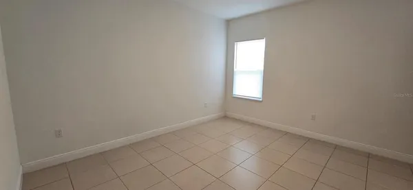 an empty room that has a window