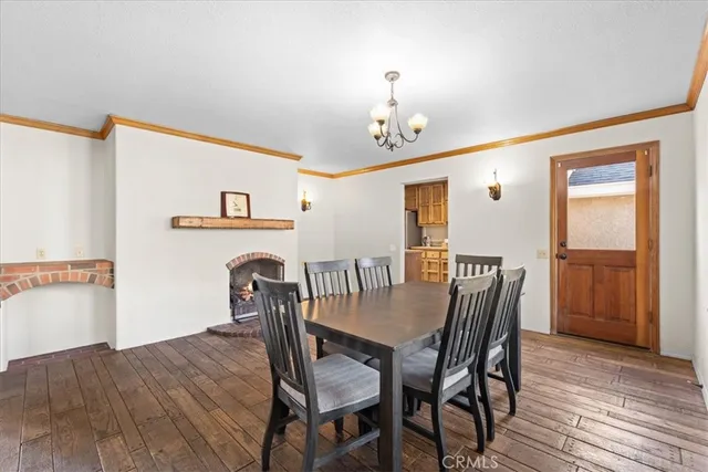 a kitchen with stainless steel appliances granite countertop a refrigerator microwave and sink