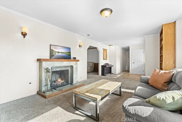 a view of a dining room with furniture and chandelier