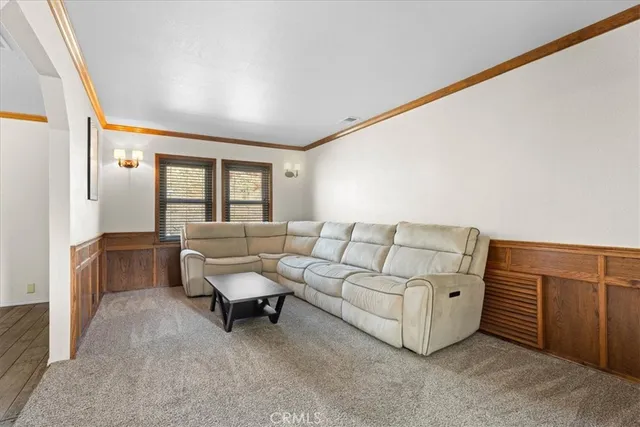 a view of a dining room with furniture wooden floor and chandelier