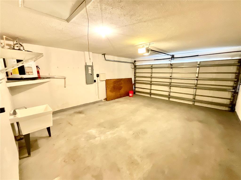 7831 Barclay Road New Port Richey, FL 34654 - Photo 32 of 34 a view of a room with racks on the wall