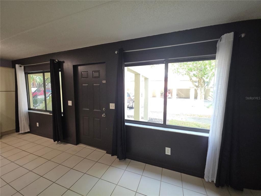 1601 Big Tree Road, Unit 901 Daytona Beach, FL 32119 - Photo 14 of 68 a bedroom with windows and closet