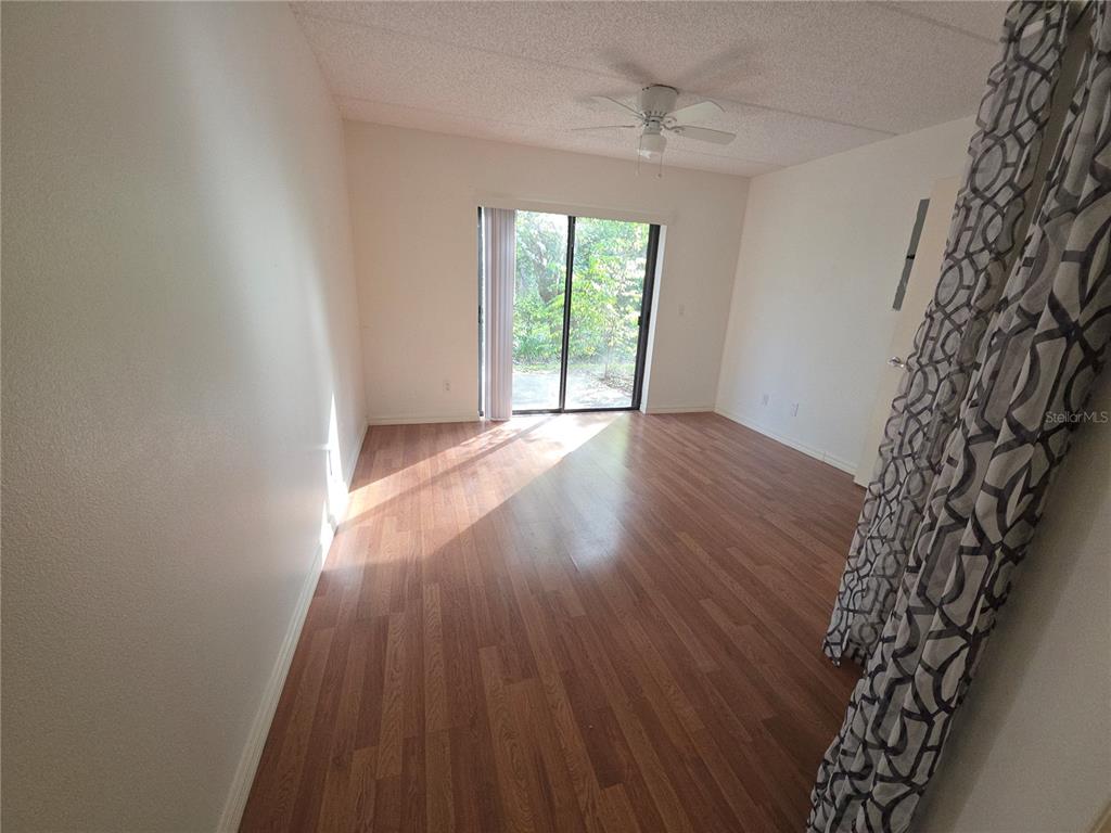 1601 Big Tree Road, Unit 901 Daytona Beach, FL 32119 - Photo 18 of 68 wooden floor in an empty room with a window