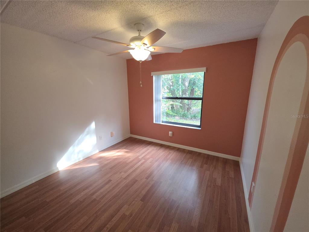 1601 Big Tree Road, Unit 901 Daytona Beach, FL 32119 - Photo 22 of 68 a view of an empty room with wooden floor and a window