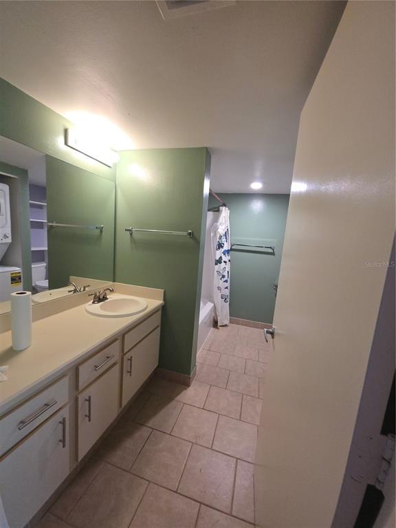 1601 Big Tree Road, Unit 901 Daytona Beach, FL 32119 - Photo 35 of 68 a bathroom with a sink a toilet and mirror