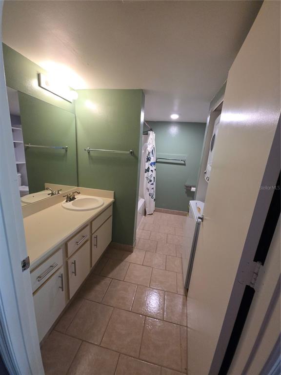 1601 Big Tree Road, Unit 901 Daytona Beach, FL 32119 - Photo 43 of 68 a bathroom with a sink a toilet and mirror