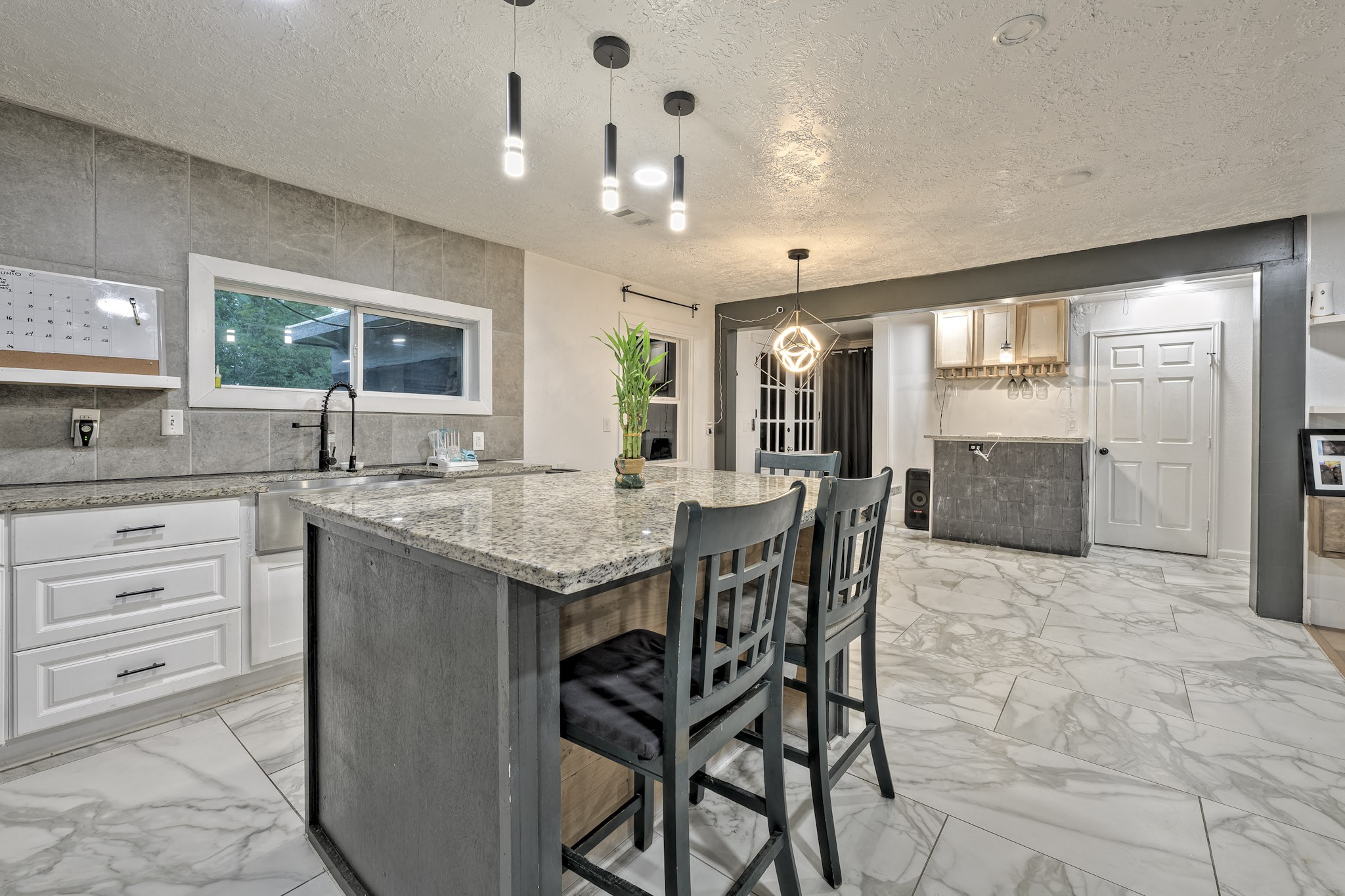 826 Rosewick Street Houston, TX 77015 - Photo 1 of 17 a kitchen with granite countertop cabinets a dining table and chairs