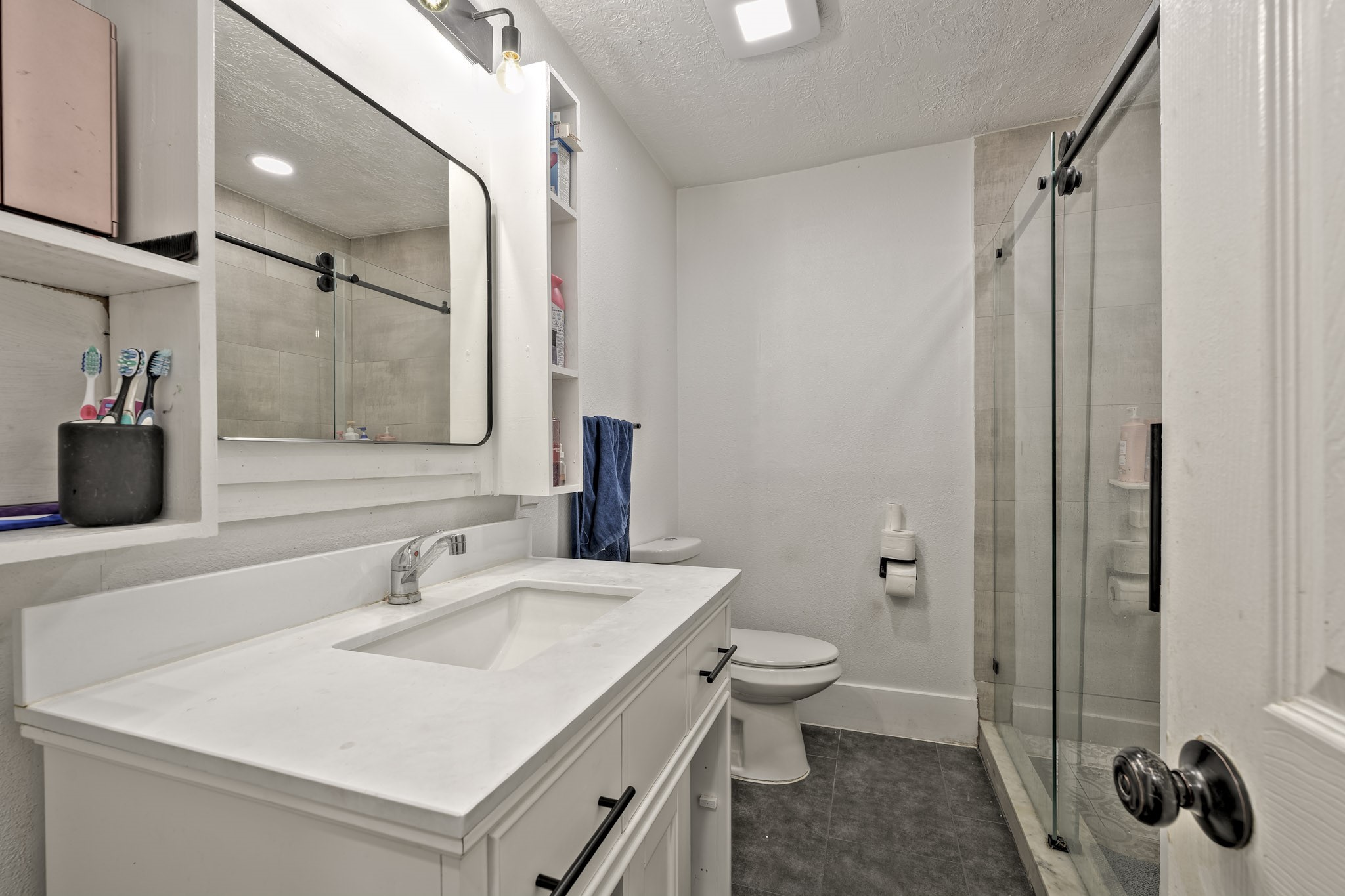 826 Rosewick Street Houston, TX 77015 - Photo 12 of 17 a bathroom with a sink toilet and shower