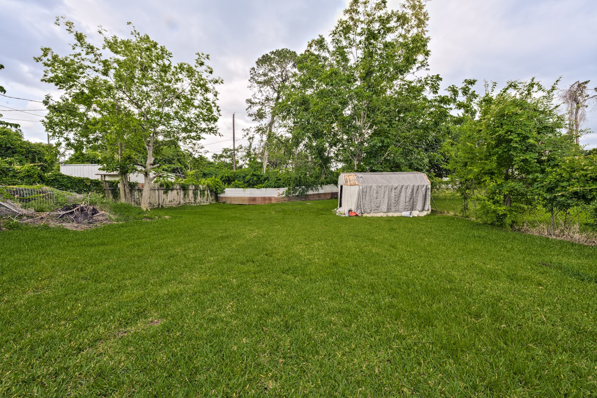 826 Rosewick Street Houston, TX 77015 - Photo 15 of 17 a white house that has a big yard and large trees