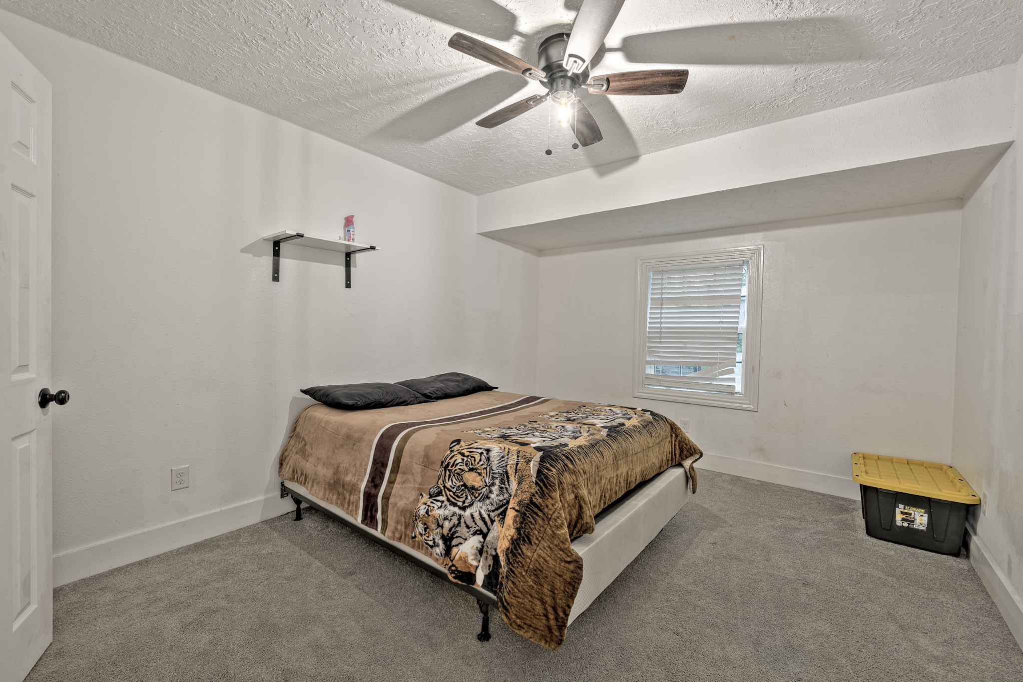 826 Rosewick Street Houston, TX 77015 - Photo 5 of 17 a bed sitting in a bedroom and chandelier