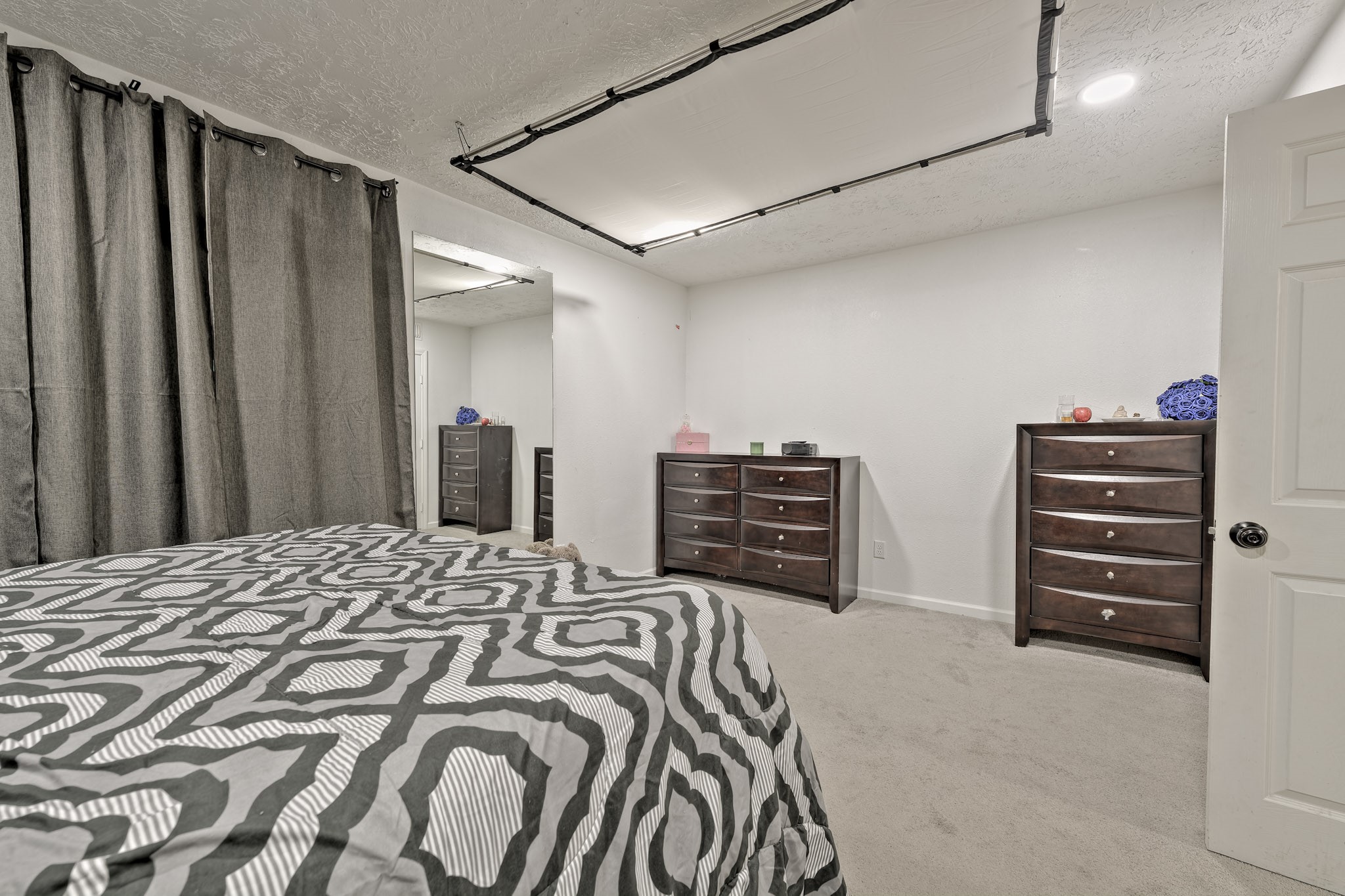 826 Rosewick Street Houston, TX 77015 - Photo 10 of 17 a bedroom with a bed and a cabinets