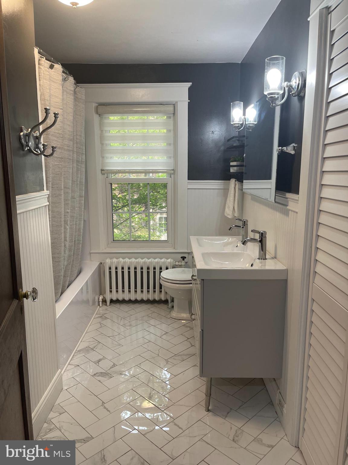523 Country Club Road York, PA 17403 - Photo 18 of 30 a bathroom with a sink a mirror and a bathtub