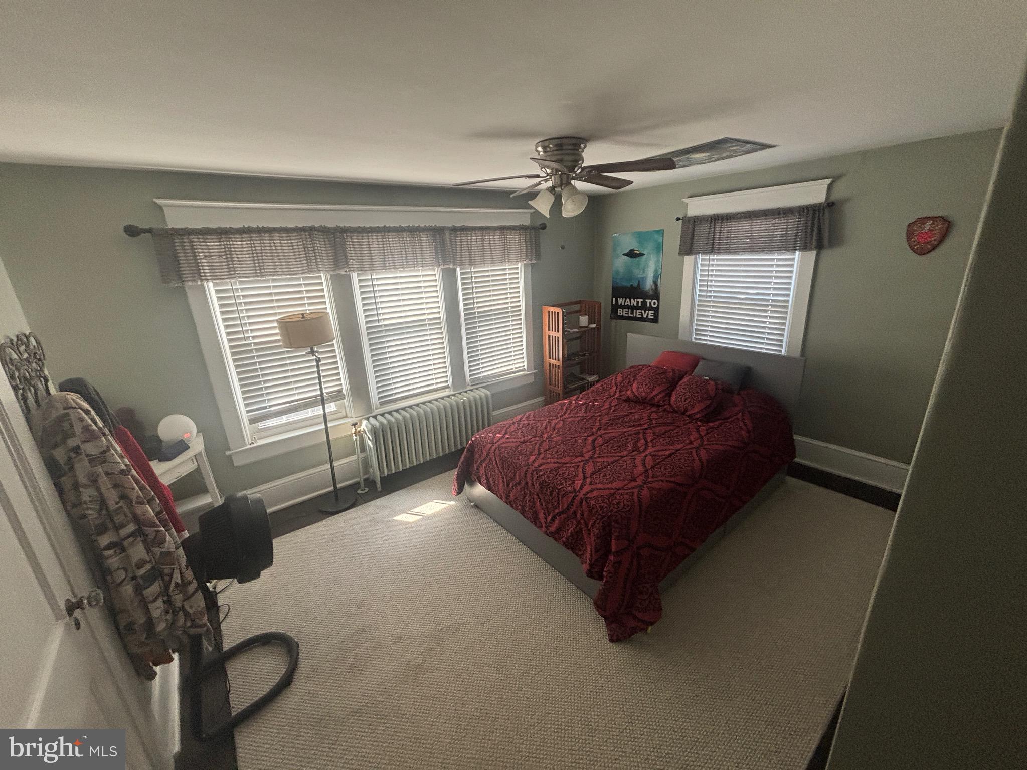 523 Country Club Road York, PA 17403 - Photo 19 of 30 a spacious bedroom with a bed a dresser and a window