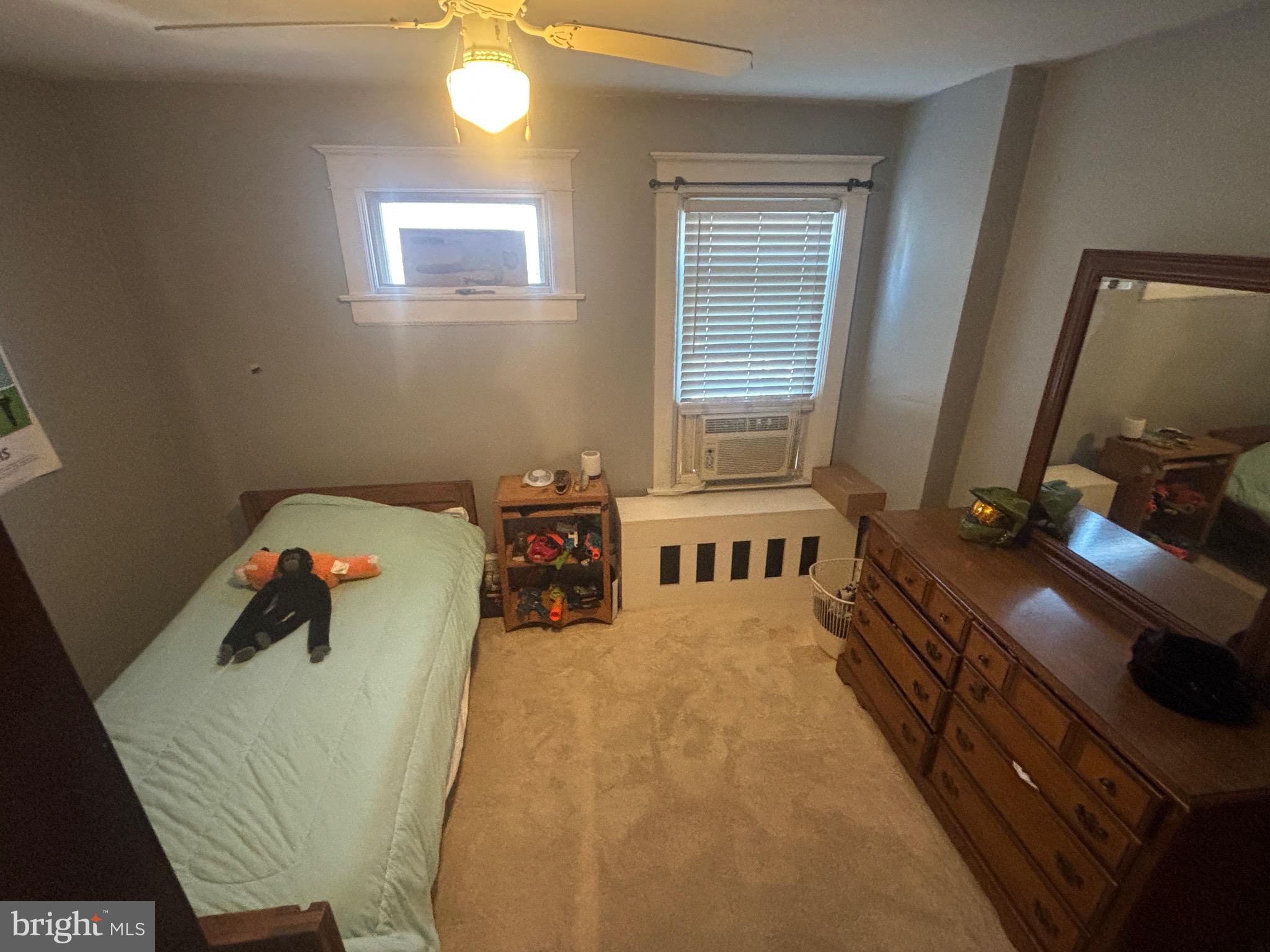 523 Country Club Road York, PA 17403 - Photo 20 of 30 a bedroom with a bed and a flat tv screen on the dresser
