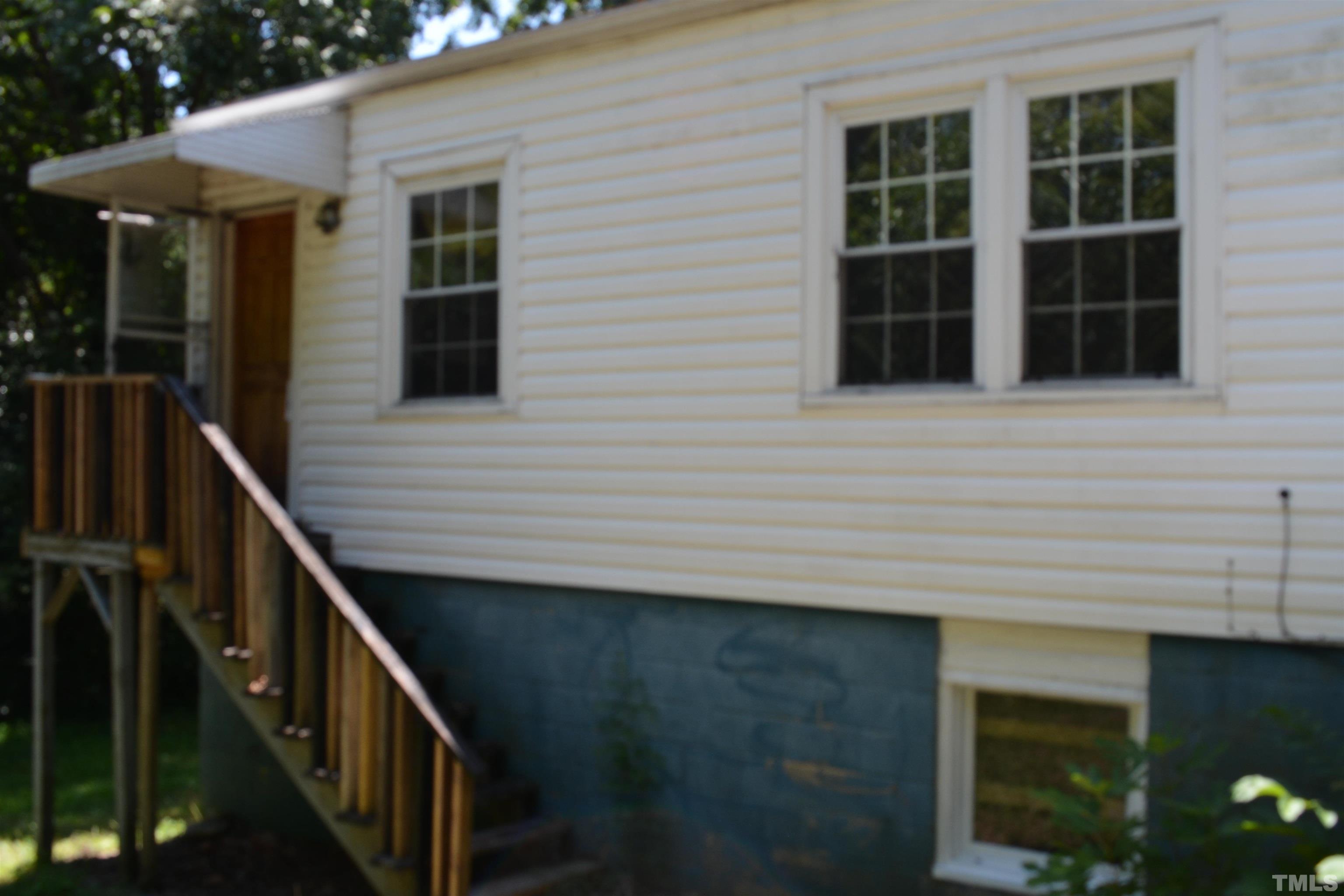 615 Arnette Avenue Durham, NC 27701 - Photo 12 of 12 a view of house with trees in front of house
