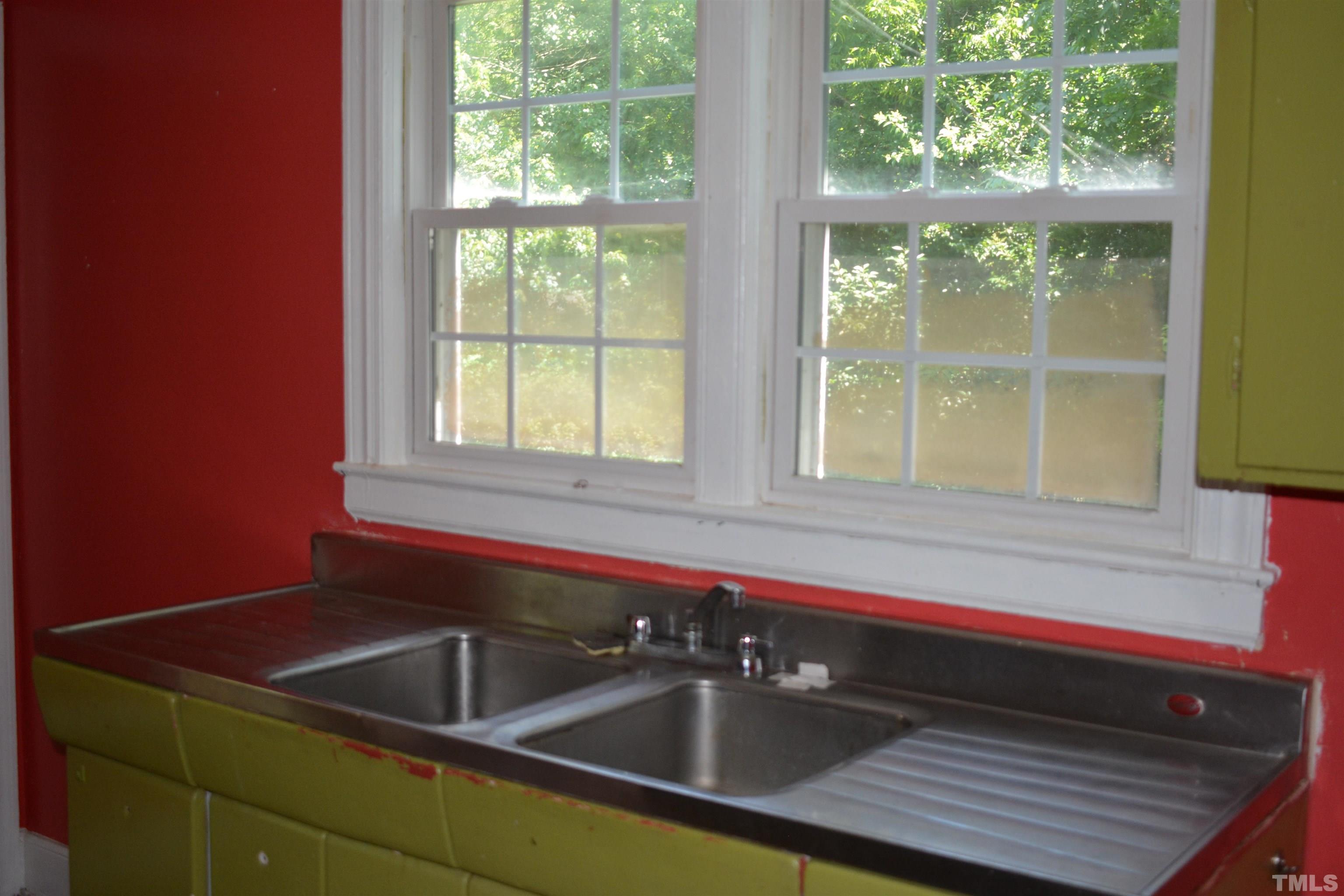 615 Arnette Avenue Durham, NC 27701 - Photo 8 of 12 a kitchen with a sink and a window