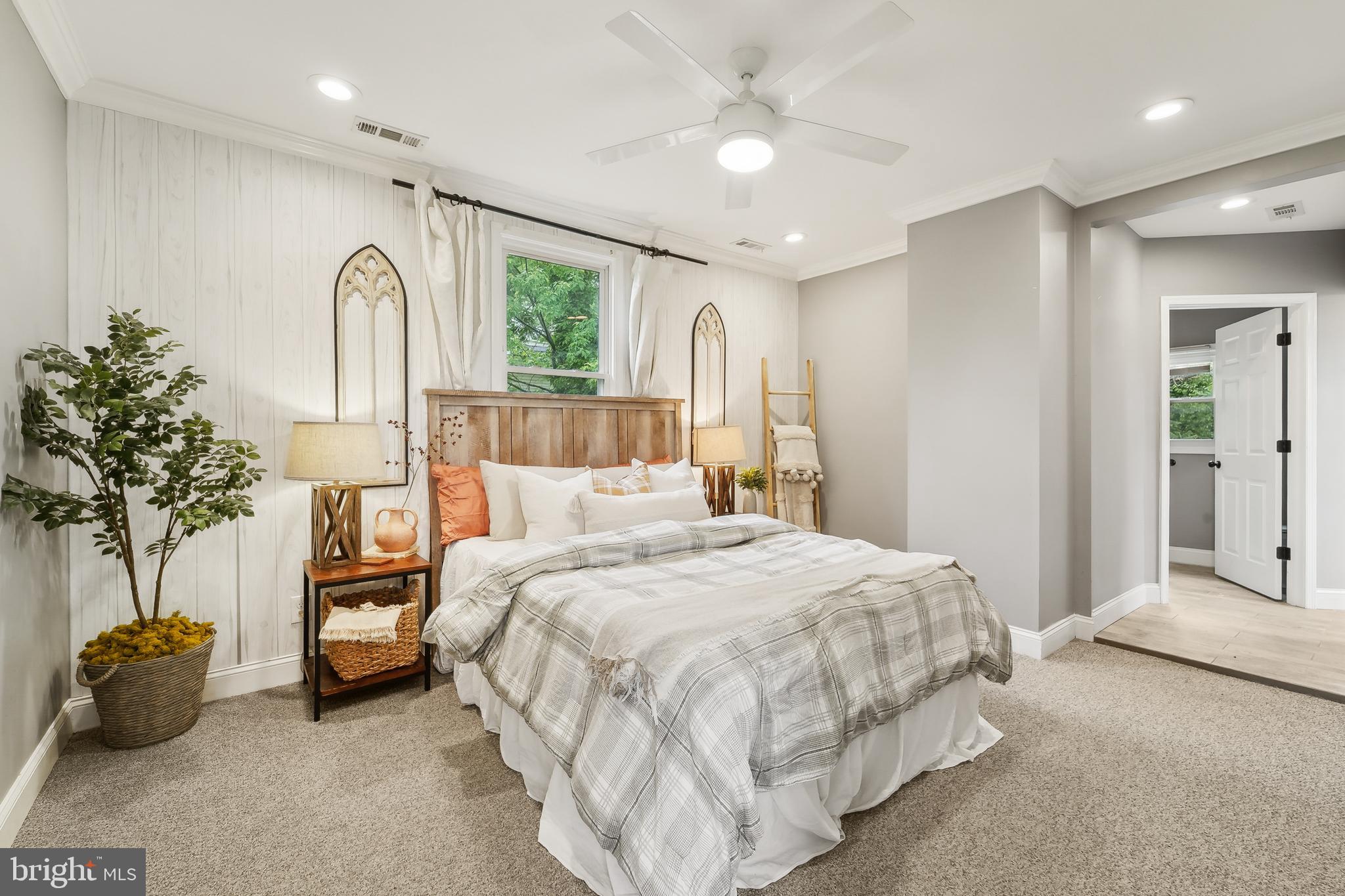 4124 Hamilton Avenue Baltimore, MD 21206 - Photo 24 of 41 a bedroom with bed and a chandelier