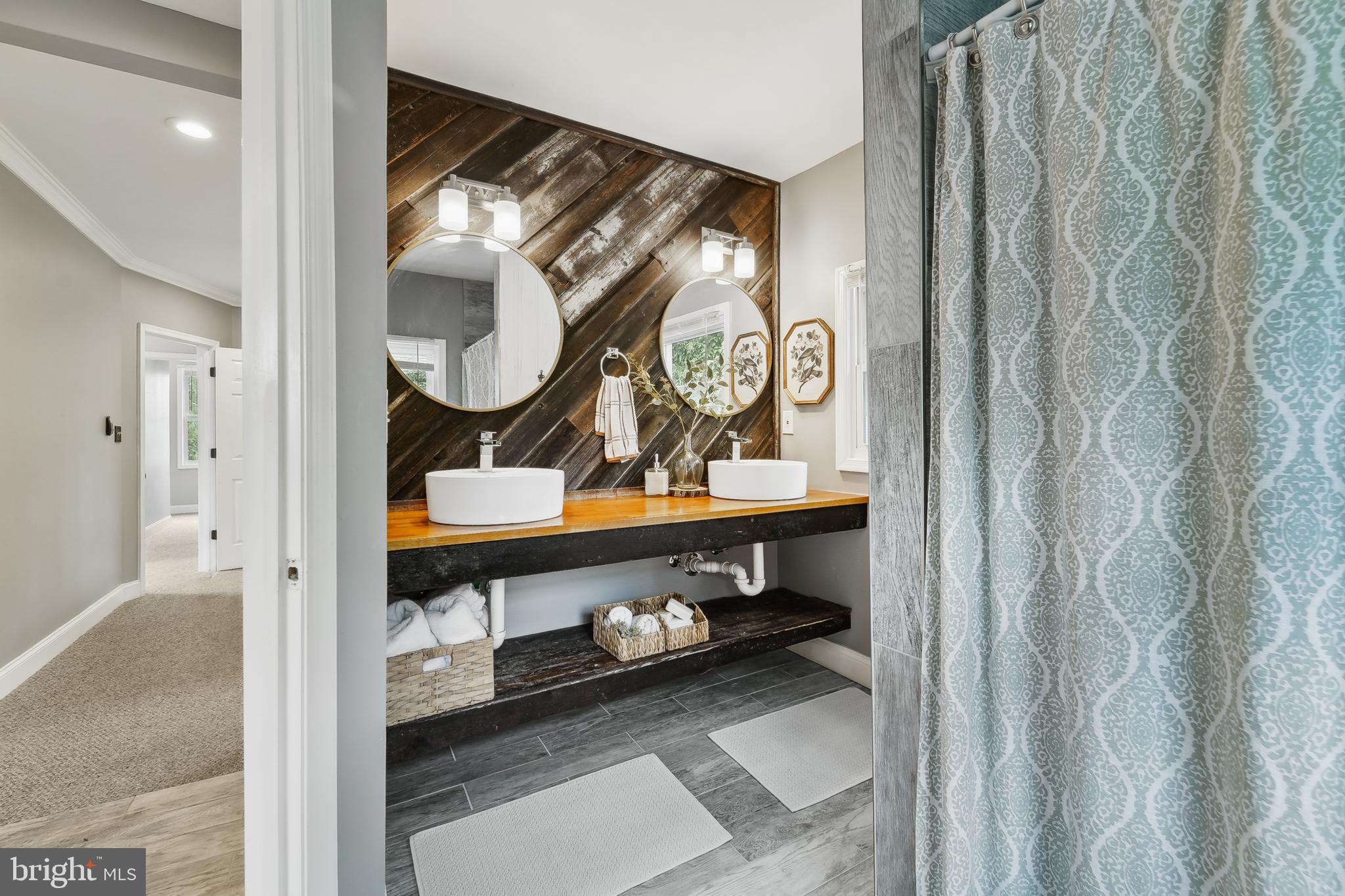 4124 Hamilton Avenue Baltimore, MD 21206 - Photo 26 of 41 a bathroom with a sink and mirror