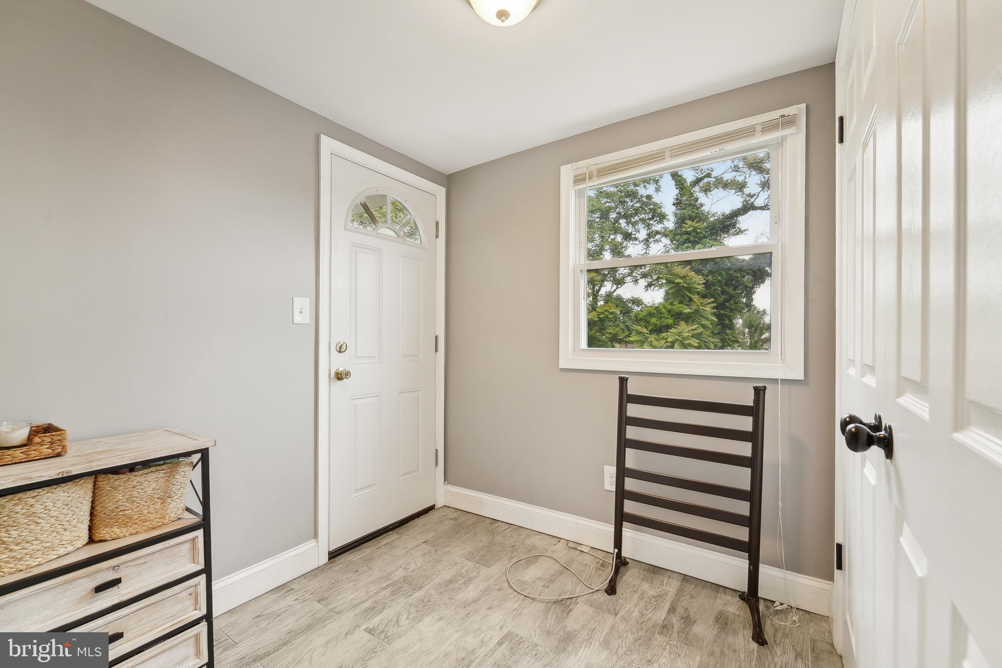 4124 Hamilton Avenue Baltimore, MD 21206 - Photo 27 of 41 a view of front door with wooden floor