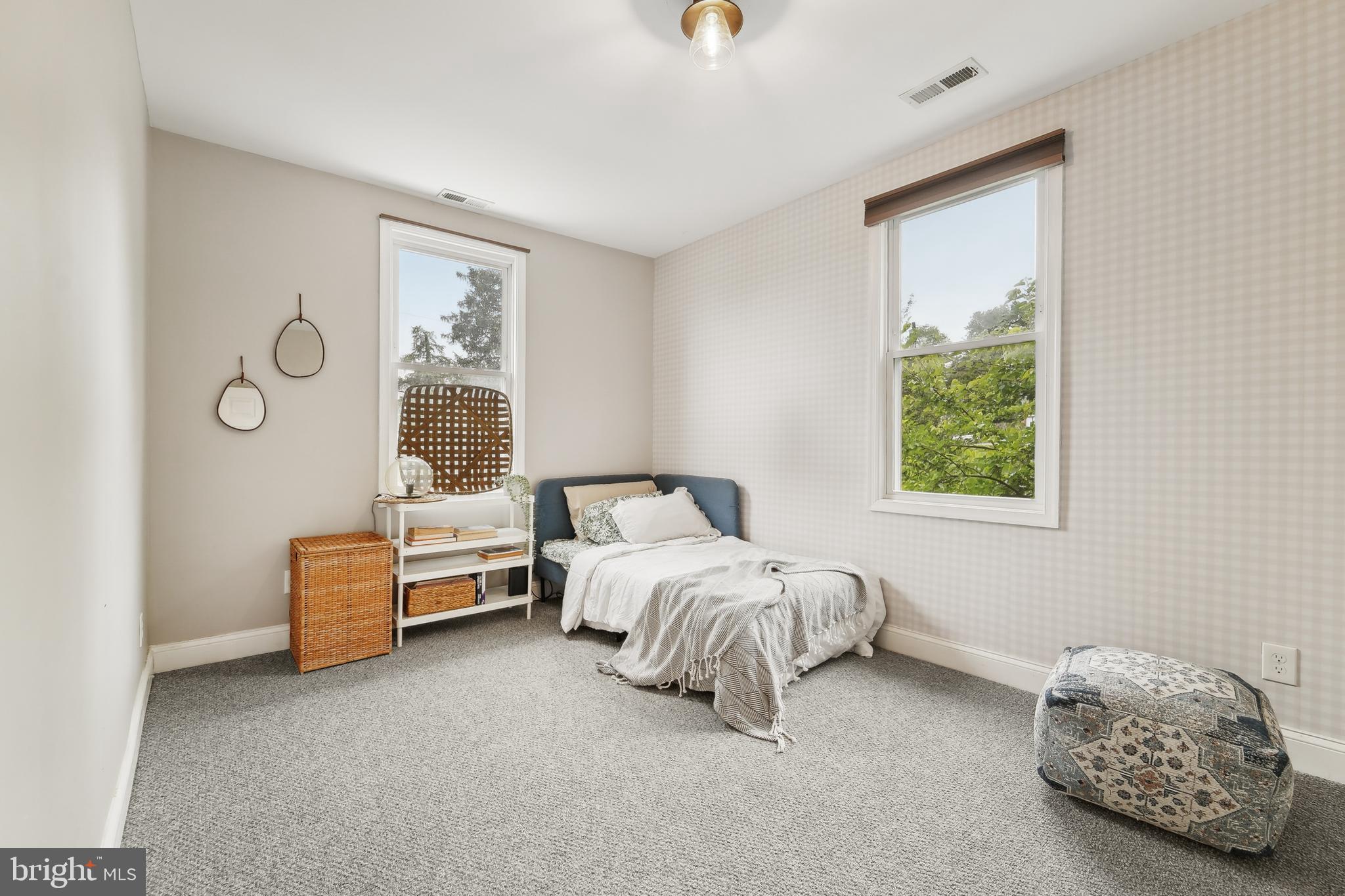 4124 Hamilton Avenue Baltimore, MD 21206 - Photo 28 of 41 a bed room with a bed and a window