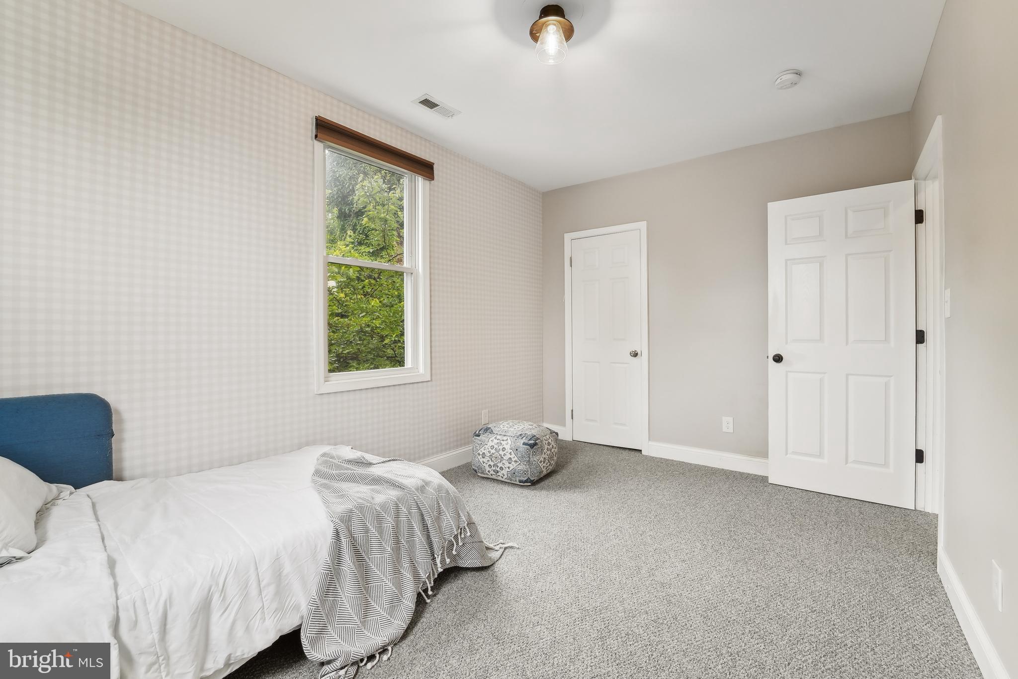 4124 Hamilton Avenue Baltimore, MD 21206 - Photo 29 of 41 a bedroom with a bed and window