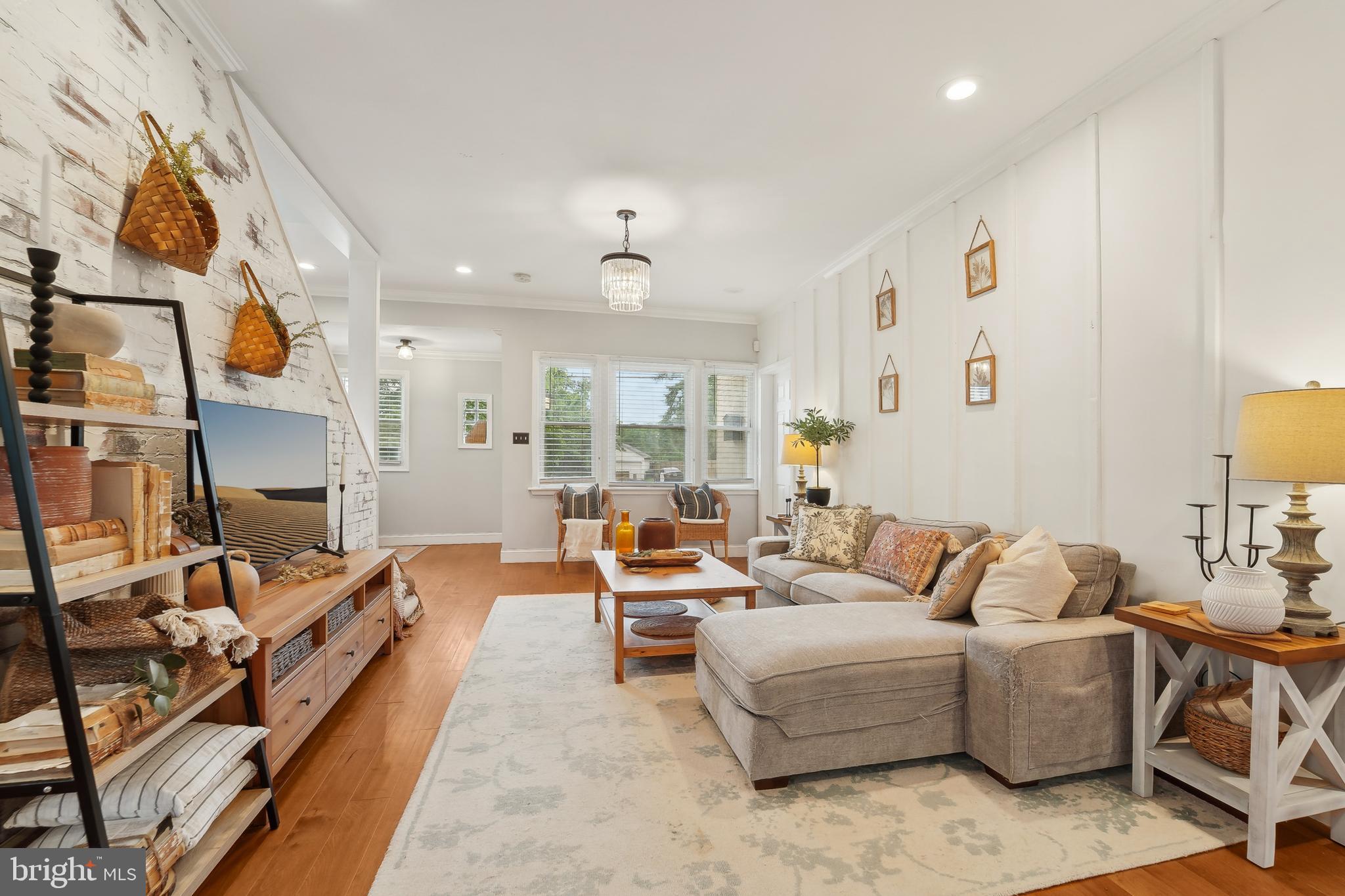 4124 Hamilton Avenue Baltimore, MD 21206 - Photo 10 of 41 a living room with furniture and a fireplace