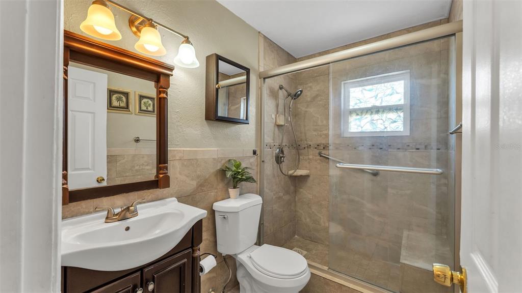 515 Easy Street Bartow, FL 33830 - Photo 11 of 25 a bathroom with a sink a toilet and shower