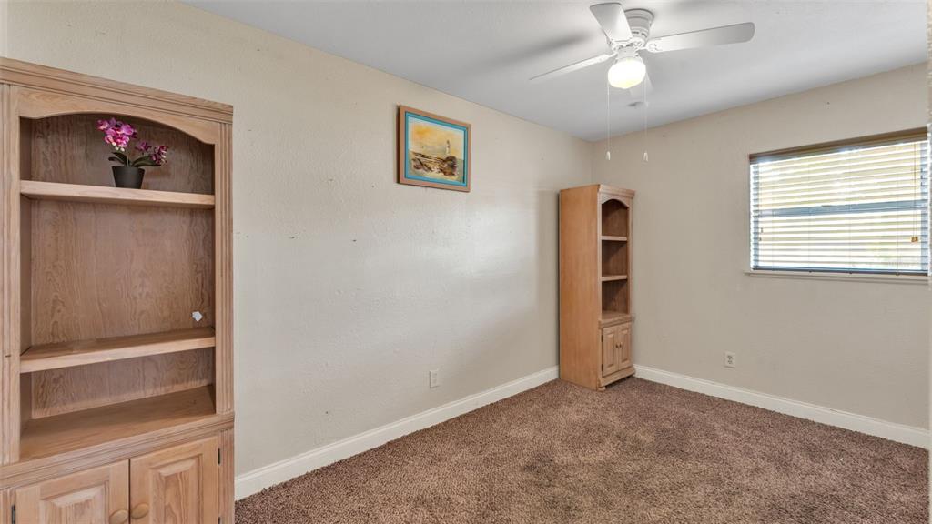 515 Easy Street Bartow, FL 33830 - Photo 14 of 25 a view of empty room with wooden floor and window