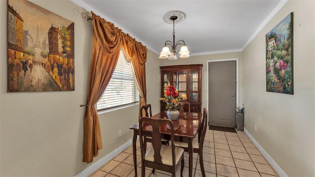 515 Easy Street Bartow, FL 33830 - Photo 9 of 25 a view of a dining room with furniture and chandelier
